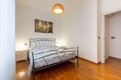 Letto o letti in una camera di GuestHost - Blu&Yellow Apartment in Parma Station