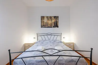 Letto o letti in una camera di GuestHost - Blu&Yellow Apartment in Parma Station