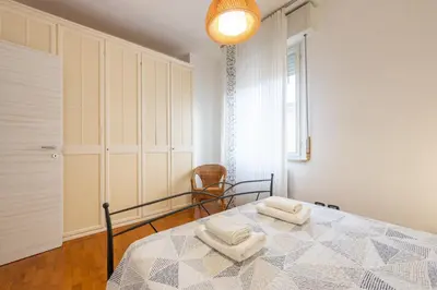 Letto o letti in una camera di GuestHost - Blu&Yellow Apartment in Parma Station
