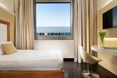Letto o letti in una camera di Hotel La Favorita