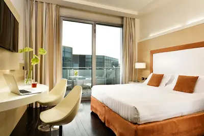 Letto o letti in una camera di Hotel La Favorita