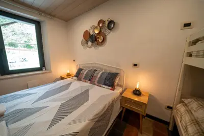 Letto o letti in una camera di La Torre Medievale - Storia e Comfort