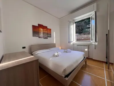 Letto o letti in una camera di JOIVY Inviting 1-bedroom flat with Balcony in Rapallo