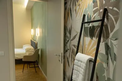 Letto o letti in una camera di Giardini Rooms