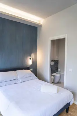 Letto o letti in una camera di Giardini Rooms
