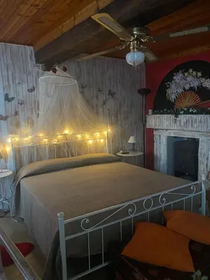 Letto o letti in una camera di JOLIE PETITE MAISON chez Barbara