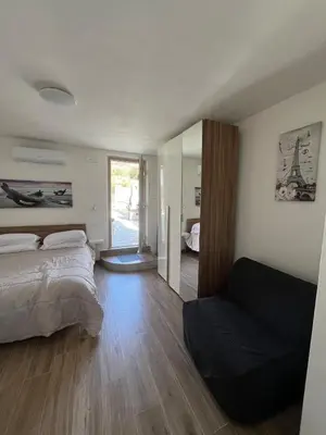 Letto o letti in una camera di House Holidays da Oneglia