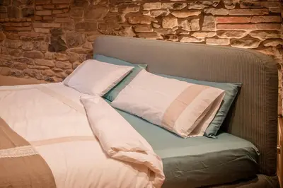 Letto o letti in una camera di Corte Finzi
