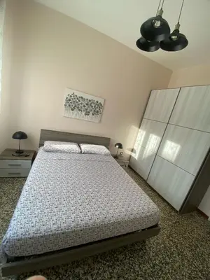 Letto o letti in una camera di Mantova sweet home