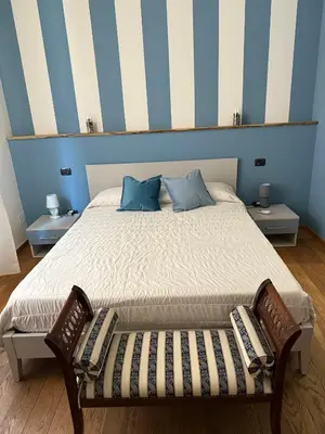 Letto o letti in una camera di Rooms primo piano