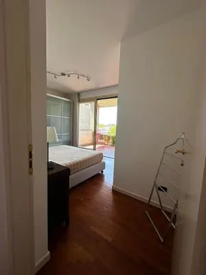 Letto o letti in una camera di Appartamento luminoso