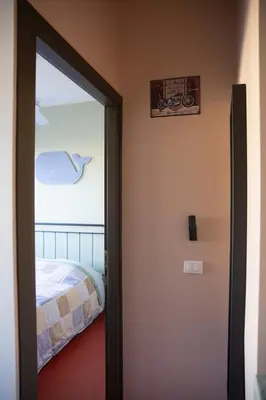 Letto o letti in una camera di Casa silenziosa Via Eraldo fico 100 Sestri levante
