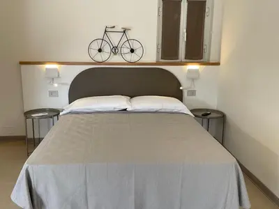 Letto o letti in una camera di Livin' Rooms