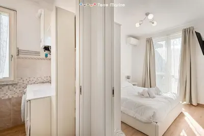 Letto o letti in una camera di Cherry, Terre Marine