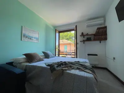 Letto o letti in una camera di Apartment in the greenery near the Cinque Terre