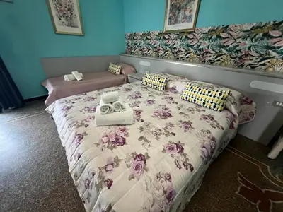 Letto o letti in una camera di Hotel & Garden