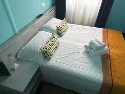 Letto o letti in una camera di Hotel & Garden
