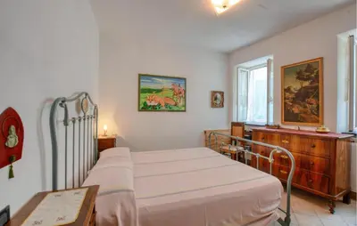Letto o letti in una camera di 2 Bedroom Nice Apartment In Moneglia