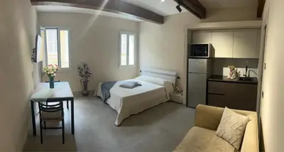 Letto o letti in una camera di Smartroom Lula di Correggio