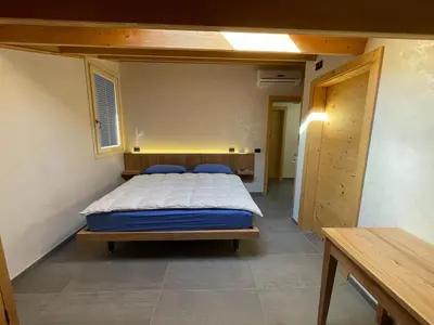 Letto o letti in una camera di Tanca RE