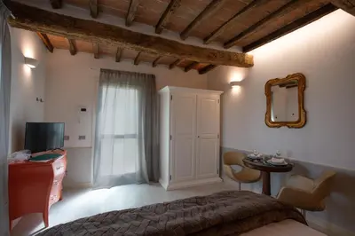 TV o dispositivi per l'intrattenimento presso Cattania Suites and Rooms