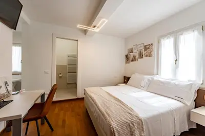 Letto o letti in una camera di Due Maestà Home