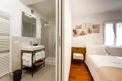 Letto o letti in una camera di Due Maestà Home