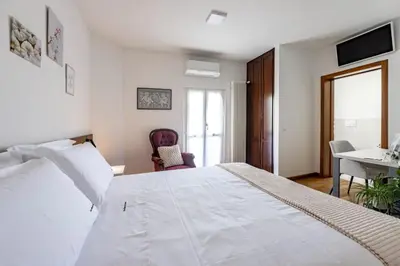 Letto o letti in una camera di Due Maestà Home