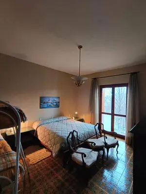 Letto o letti in una camera di Villa Giordani affittacamere Boscoreale