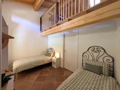 Letto o letti in una camera di CasaRosmarino