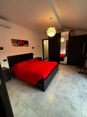 Letto o letti in una camera di Modern Apartment with Balcony 2 Bedrooms & 2 Bathrooms near Cremona Fair