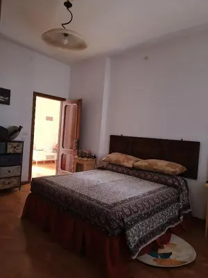 Letto o letti in una camera di Cosy flat la Casa di Gianco