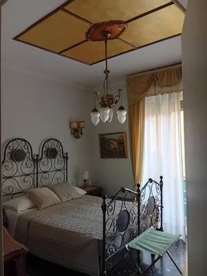 Letto o letti in una camera di B&B Assereto