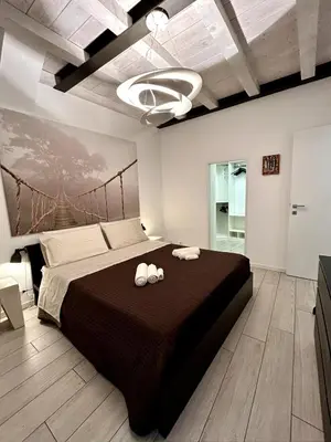 Letto o letti in una camera di A Casa di Lamu, eleganza in Piazza della Vittoria, 140mq