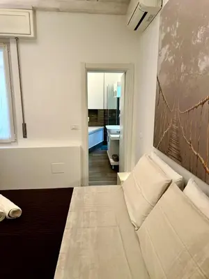 Letto o letti in una camera di A Casa di Lamu, eleganza in Piazza della Vittoria, 140mq