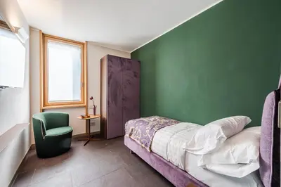 Letto o letti in una camera di FuoriPorta Affitti Brevi - Mirafiori - Ca' San Giorgio 104