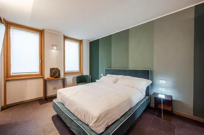 Letto o letti in una camera di FuoriPorta Affitti Brevi - Mirafiori - Ca' San Giorgio 104