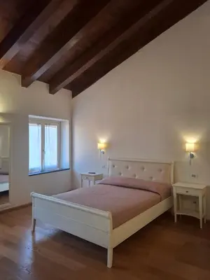 Letto o letti in una camera di Albergo Palazzo Costa