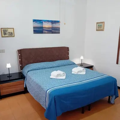 Letto o letti in una camera di Casa Milanesi