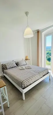 Letto o letti in una camera di Casa Sbollazza con parcheggio e vicino al parco