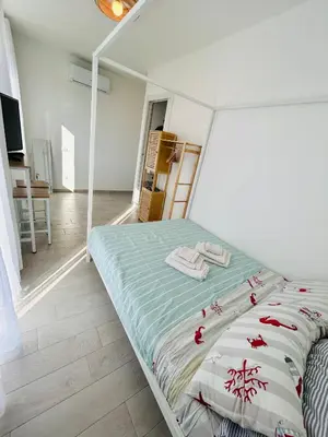 Letto o letti in una camera di Casa Sbollazza con parcheggio e vicino al parco
