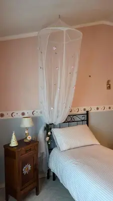 Letto o letti in una camera di Casa Maddalena