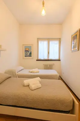 Letto o letti in una camera di WELCOME RIVIERA Nautilus 11- vista mare-posto macchina individuale-ONLY ONE CAR-piscina condominiale estiva-attrezzatissimo