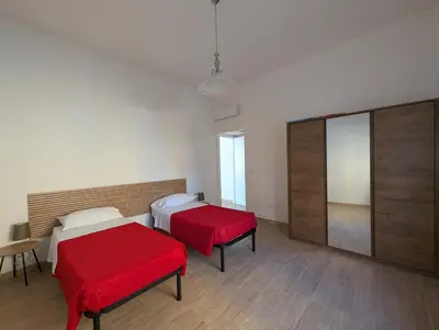 Letto o letti in una camera di Casa Francesca