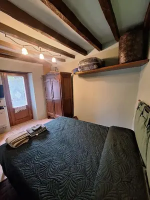 Letto o letti in una camera di R&B Piccolo Borgo Tralacosta