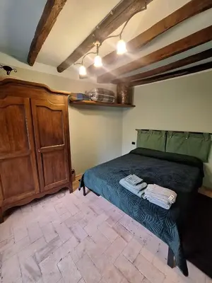 Letto o letti in una camera di R&B Piccolo Borgo Tralacosta