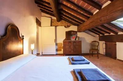Letto o letti in una camera di Bacialupo Foresteria