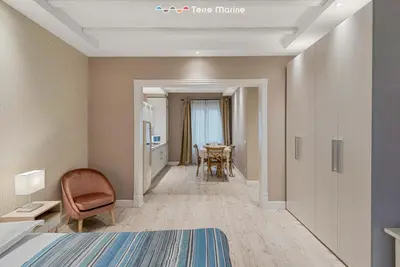 Letto o letti in una camera di Suite del Golfo, Terremarine