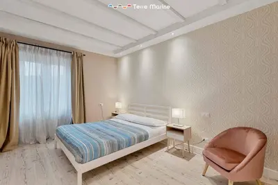 Letto o letti in una camera di Suite del Golfo, Terremarine