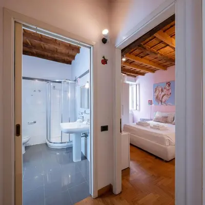 Letto o letti in una camera di Italian Experience-Dafne Suite